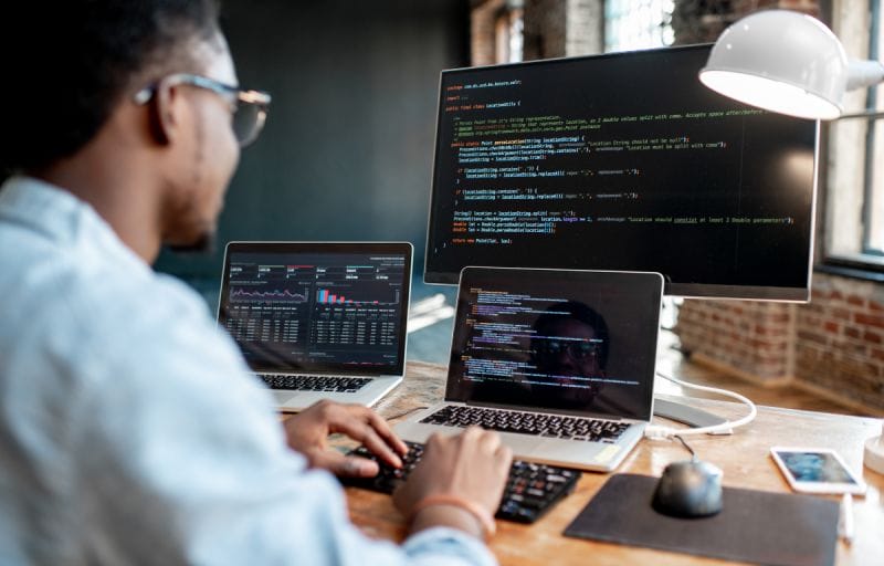 A Beginners Guide To SEO For Lawyers 10 A programmer coding