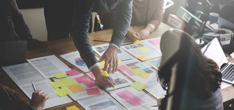 The Ultimate 2022 Guide to Law Firm Branding 6 man writing on piece of paper