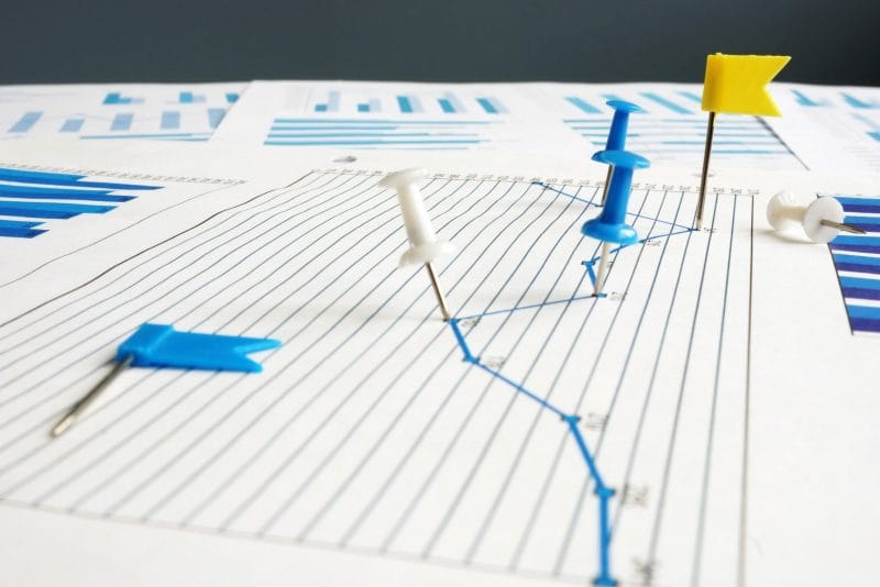 7 Key Law Firm KPIs to Track for Success 5 Thumbtacks on paper