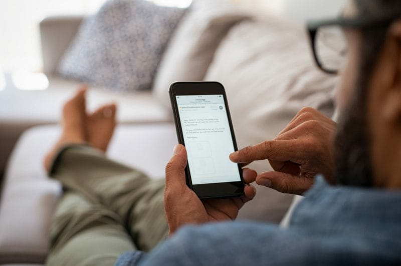 Email Marketing for Law Firms: 6 Proven Strategies to Get & Retain More Clients 17 man check email on his phone