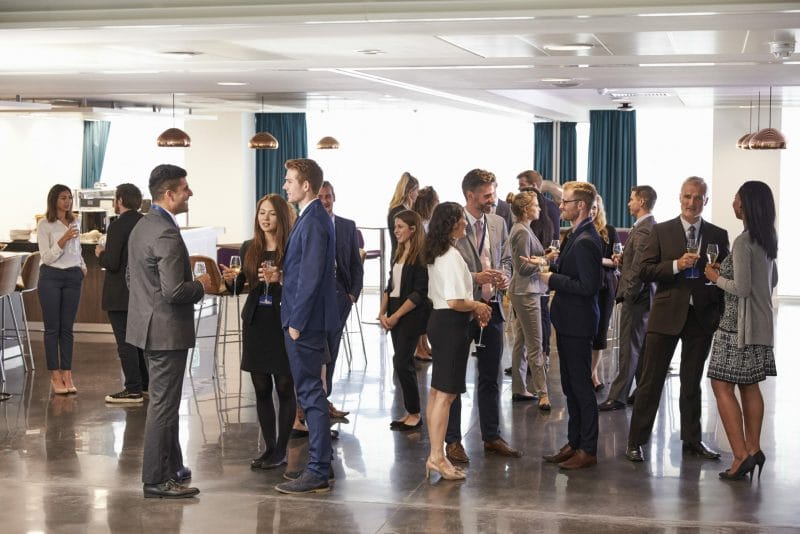 people networking at a conference