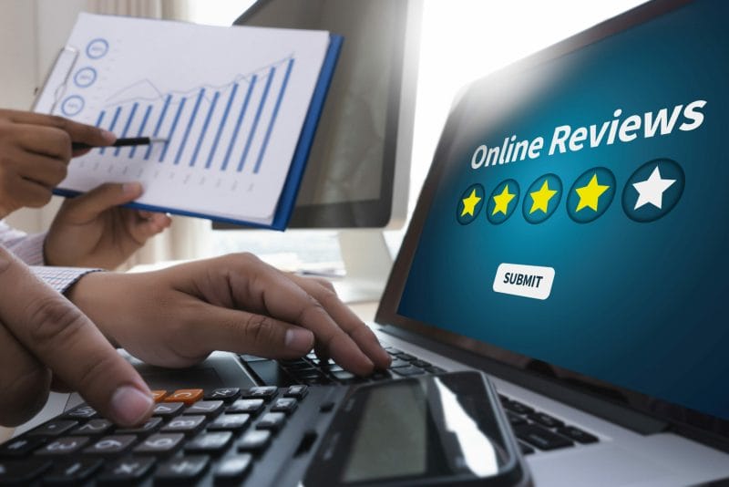 man typing and submitting an online review