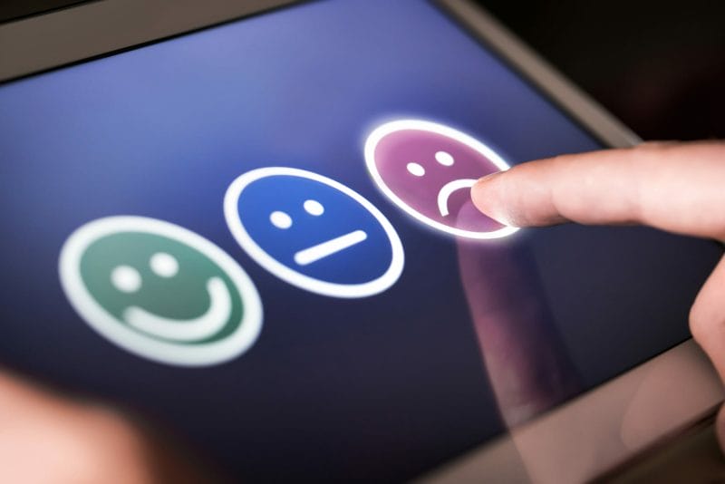 4 Effective Attorney Reputation Management Strategies 18 person disappointed and giving bad review on tablet